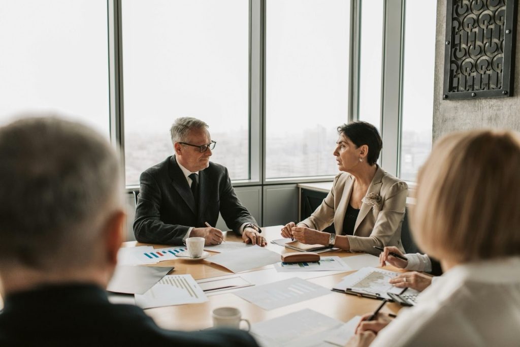 Business meeting with professionals discussing contracts and documents