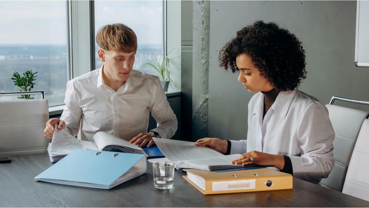 Financial team reviewing accounts receivable documents