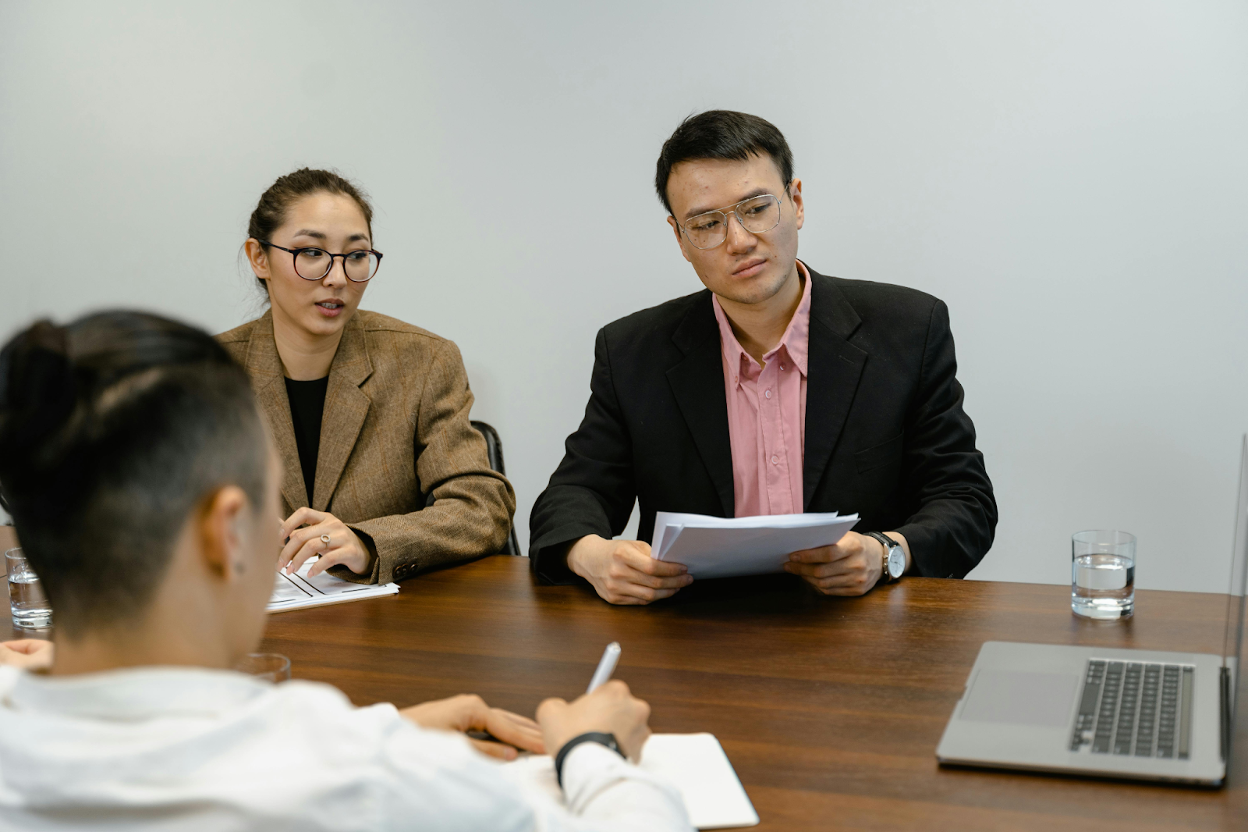 Business professionals discussing debt collection strategies