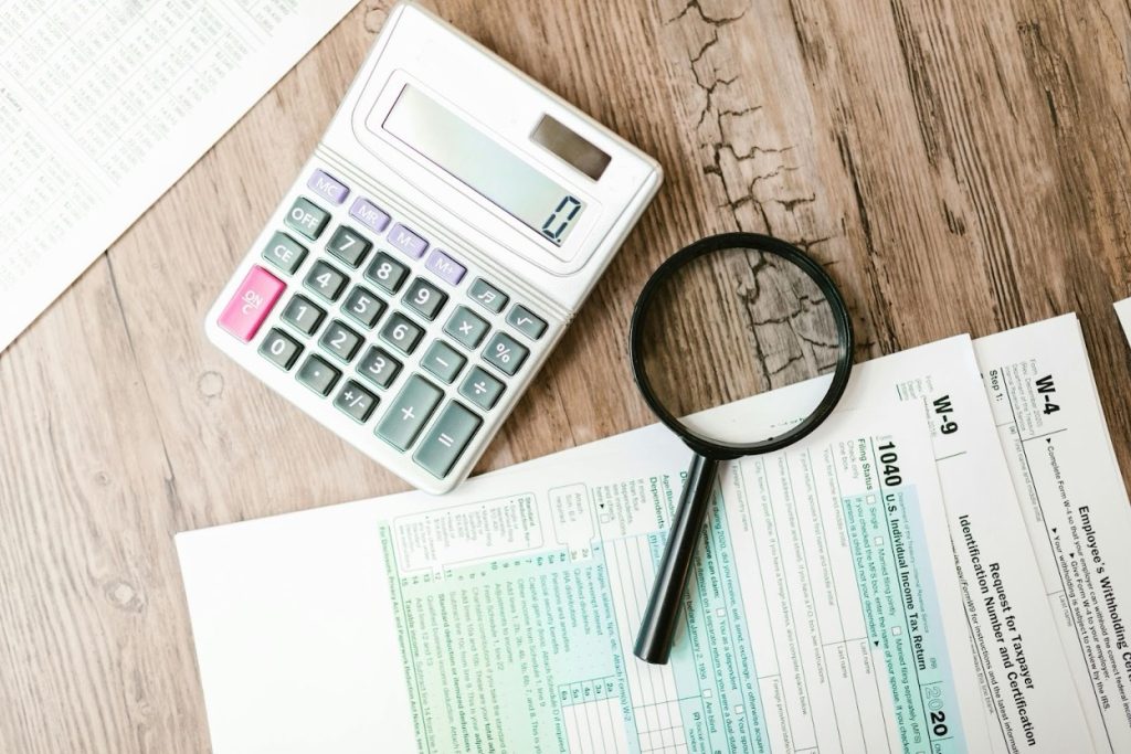 Calculator and financial documents on a desk