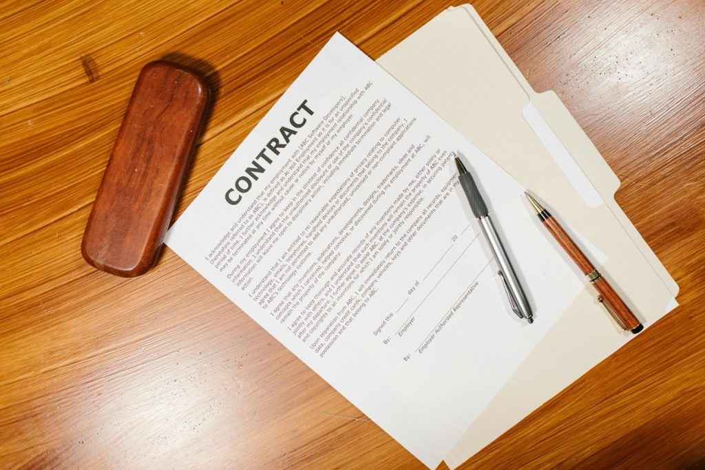 Legal documents and compliance guidelines for debt collection on the desk.