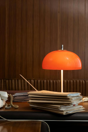 Business documents, including invoices, contracts, and delivery confirmations, organized in folders on a desk.