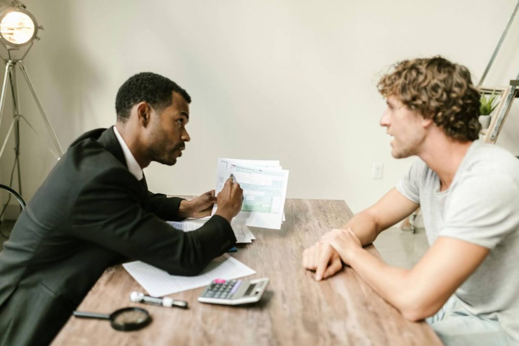 Business financial advisor explaining contingency fee structure to a Pearland business owner.