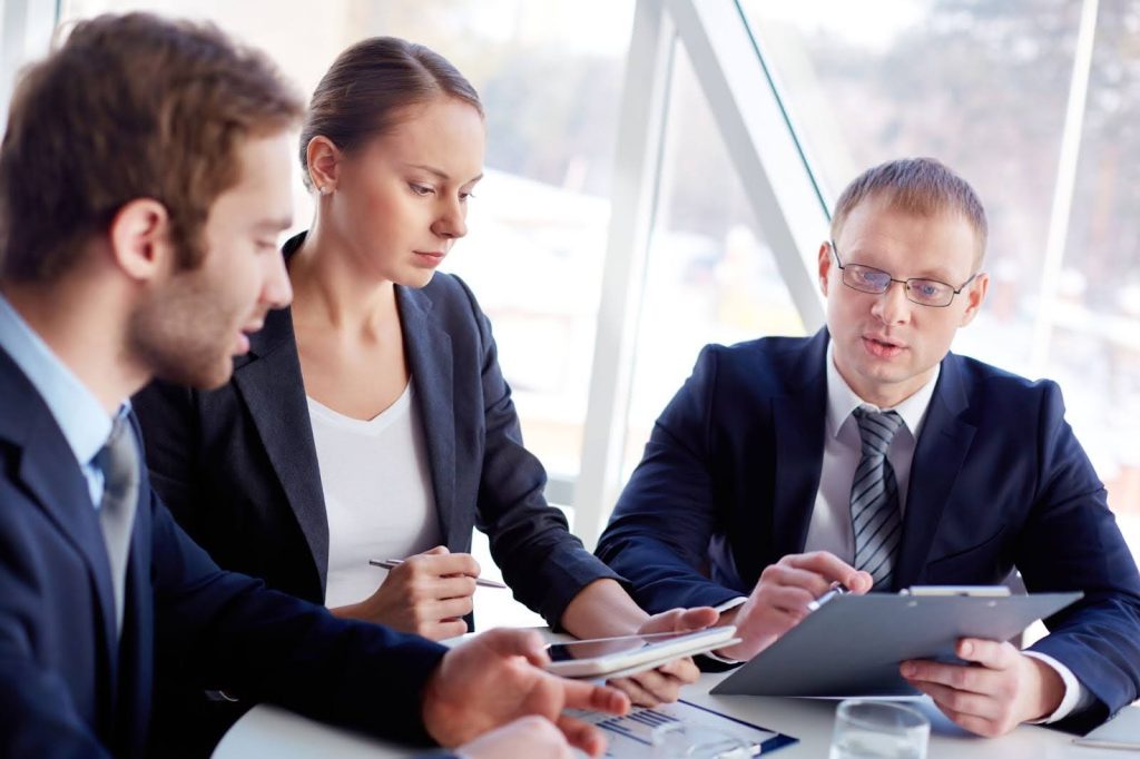 Business professional analyzing financial documents and collection agency fee structures.