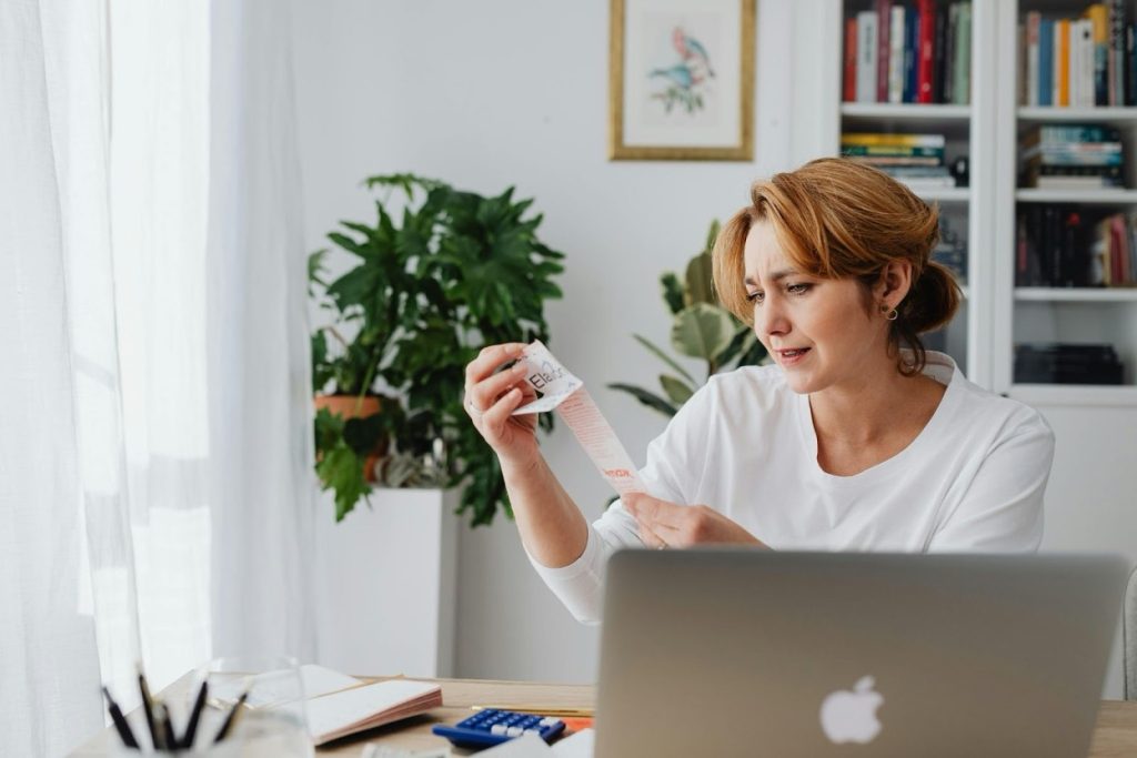 Business professional reviewing debt collection cost structure and contingency fee agreements