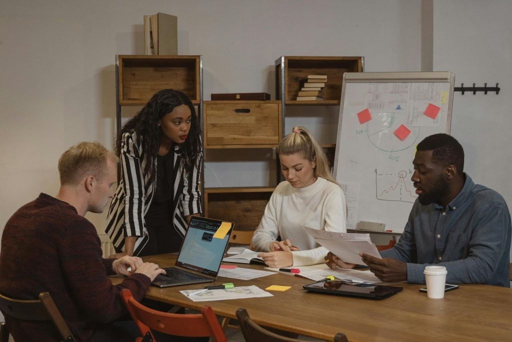 Business professionals having a strategic meeting in a modern office space.