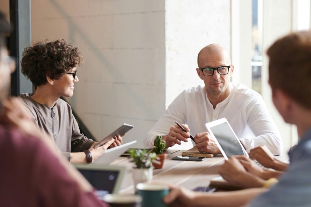Professional business meeting discussing debt collection strategies