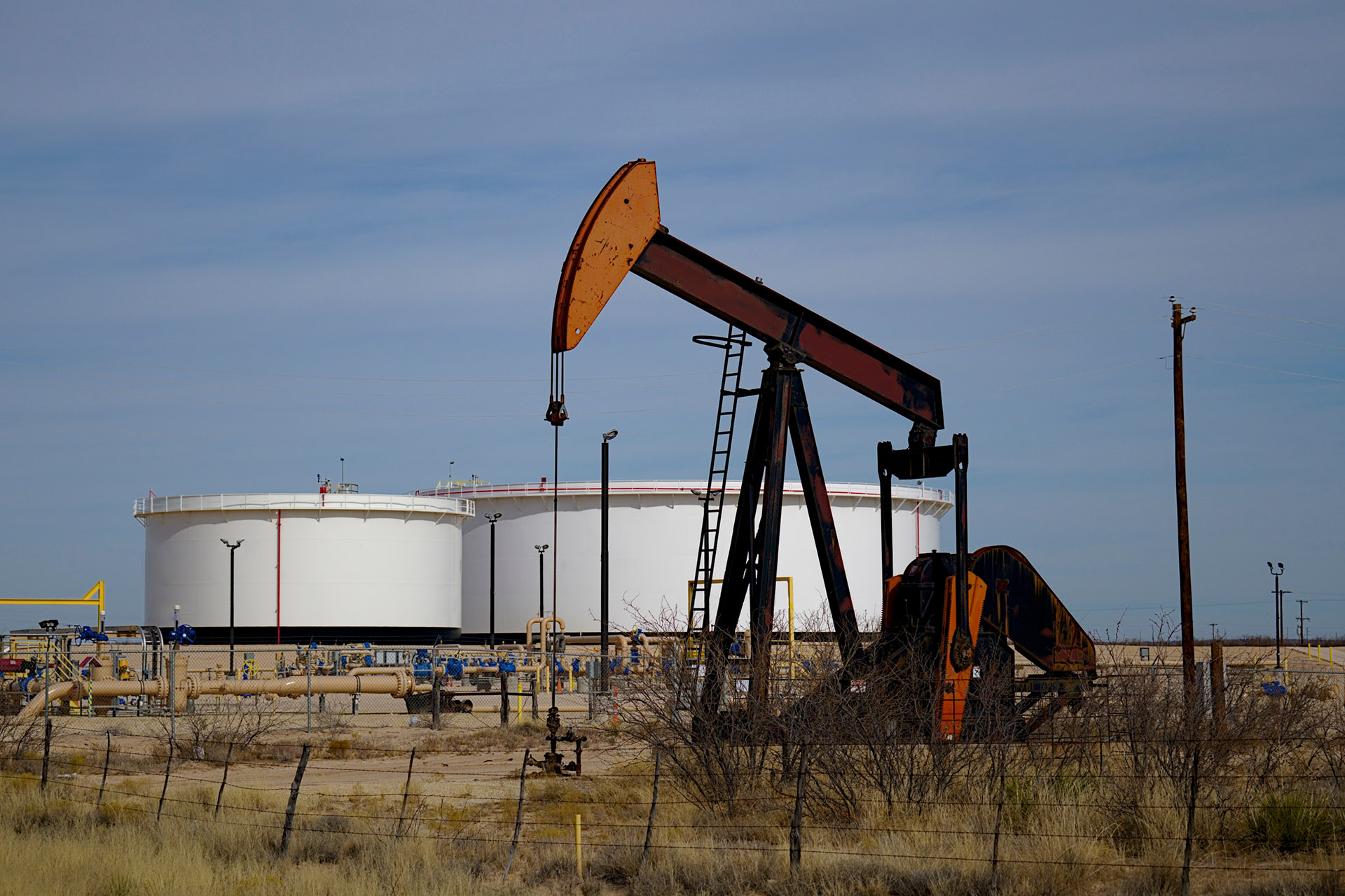 Oil Well Pumpjack Operating in Industrial Field